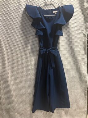 GB girls Navy Ruffle-Shoulder Jumpsuit with Waist Bow